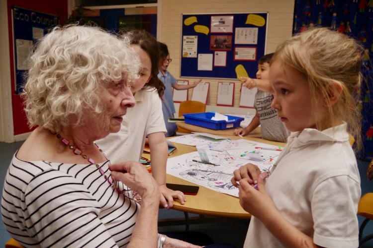 Older woman and young girl talking